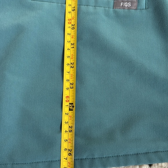 FIGS v-neck short sleeve two front pocket scrub shirt in a blue green color - Picture 15 of 16
